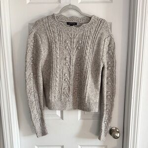 Elegant Heathered Sweater with Intricate Patterns
